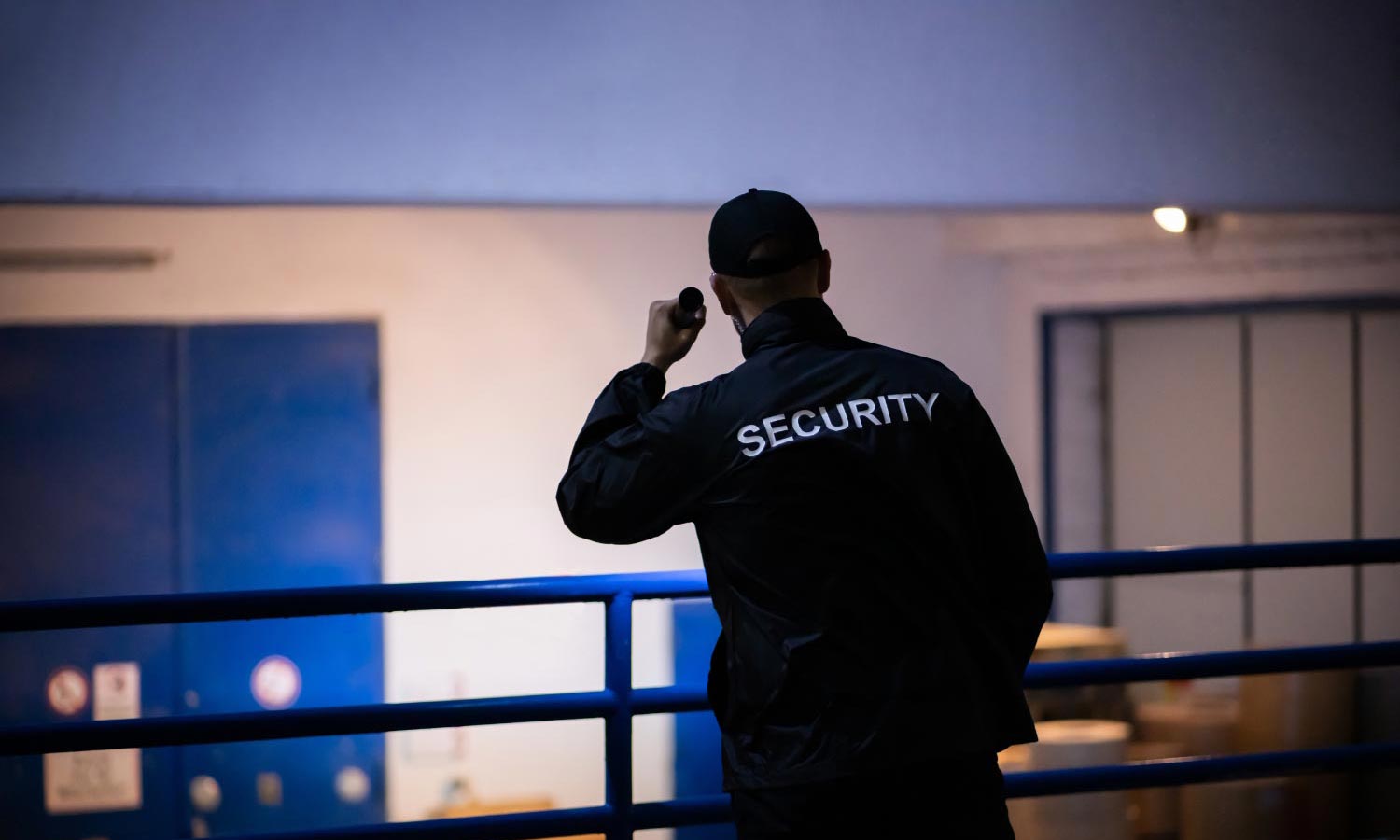 Security man holding a torch
