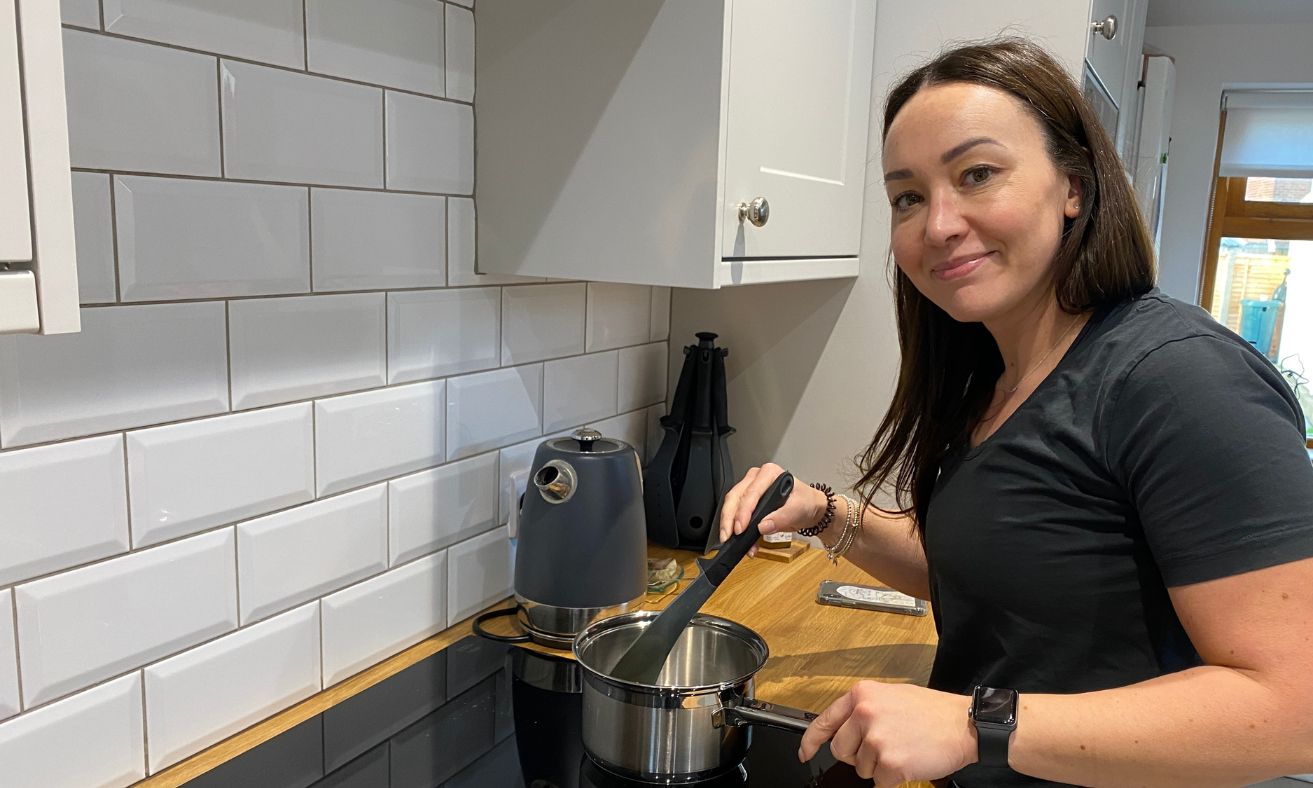 Nicola posing whilst cooking