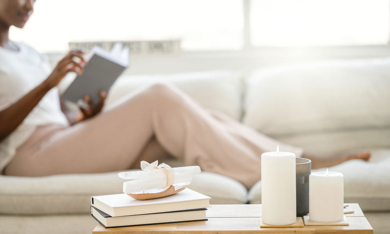 A lady relaxing with a box on the sofa