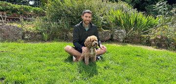 Nick with his dog in the garden