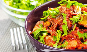 Dish with tomatoe sauce and lettuce