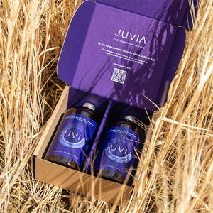 A box of JUVIA in a barley field